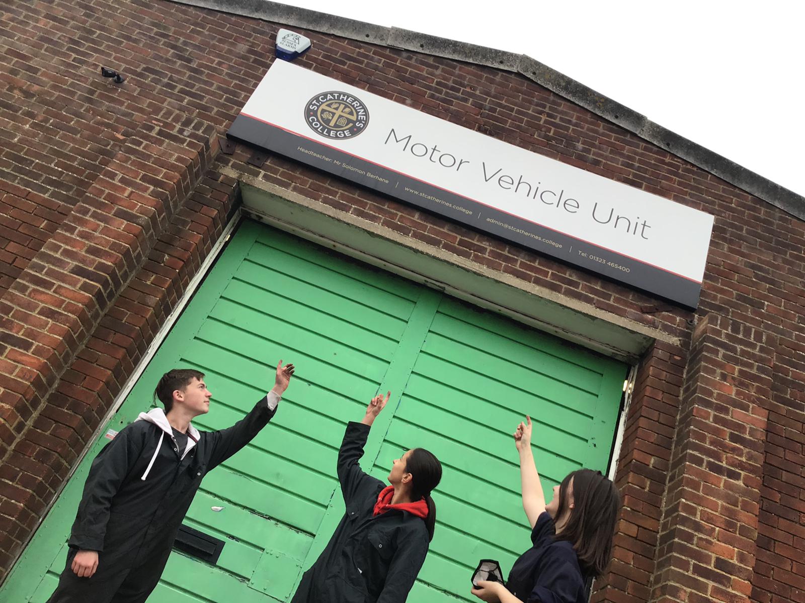 Students outside the motor vehicle unit