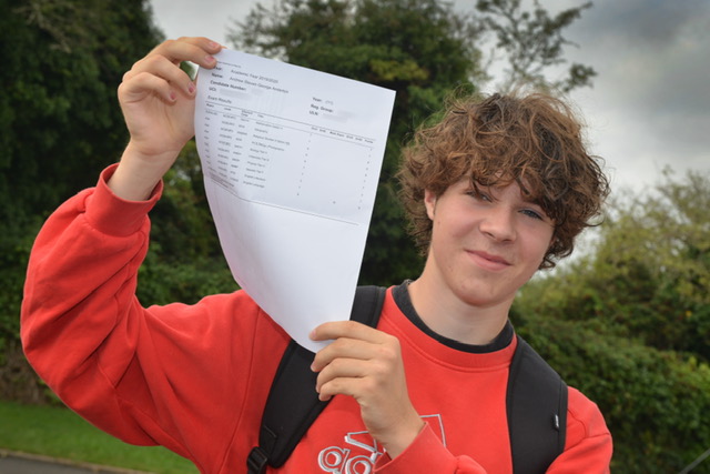 Boy holding results