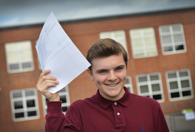 Boy holding up results