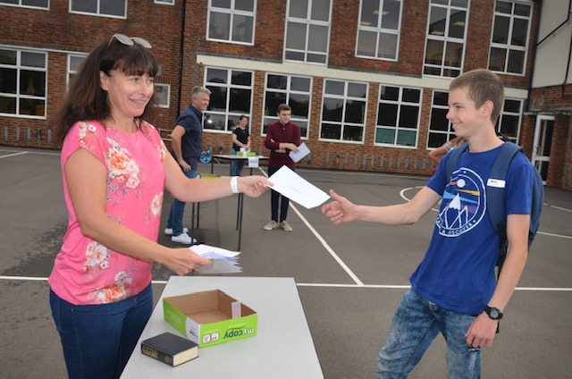 Boy in blue receiving results