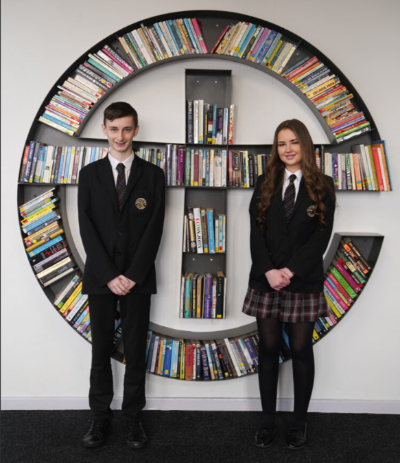 Students sitting with their teacher